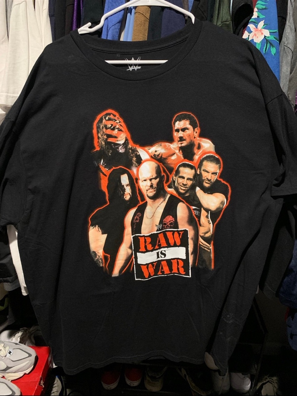 WWE Black Tee with Orange 'Raw Is War' Group Graphic